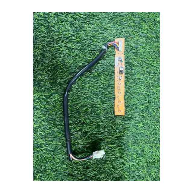 appears to be an electronic component, potentially a small circuit board with a cable and connector, often used in consumer electronics or appliances